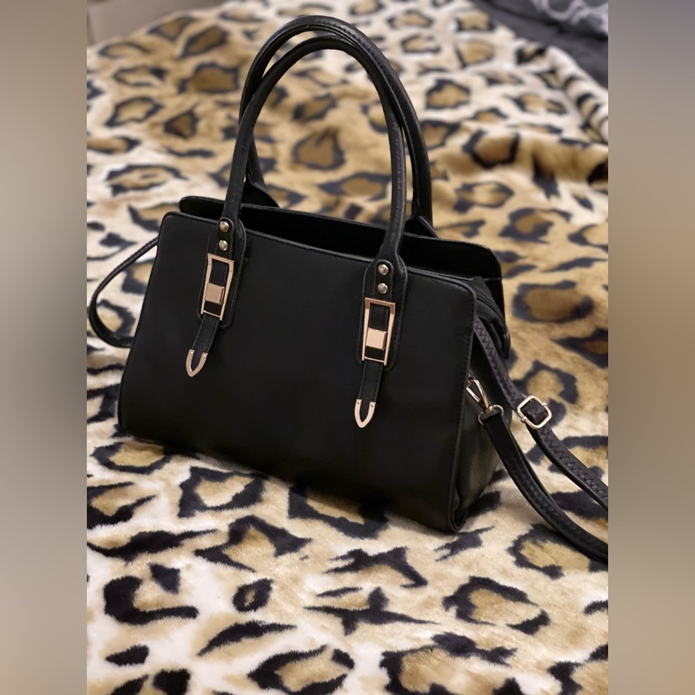 Black purse for sale gold accents zipper closure inside spacious 2 zipper pocket